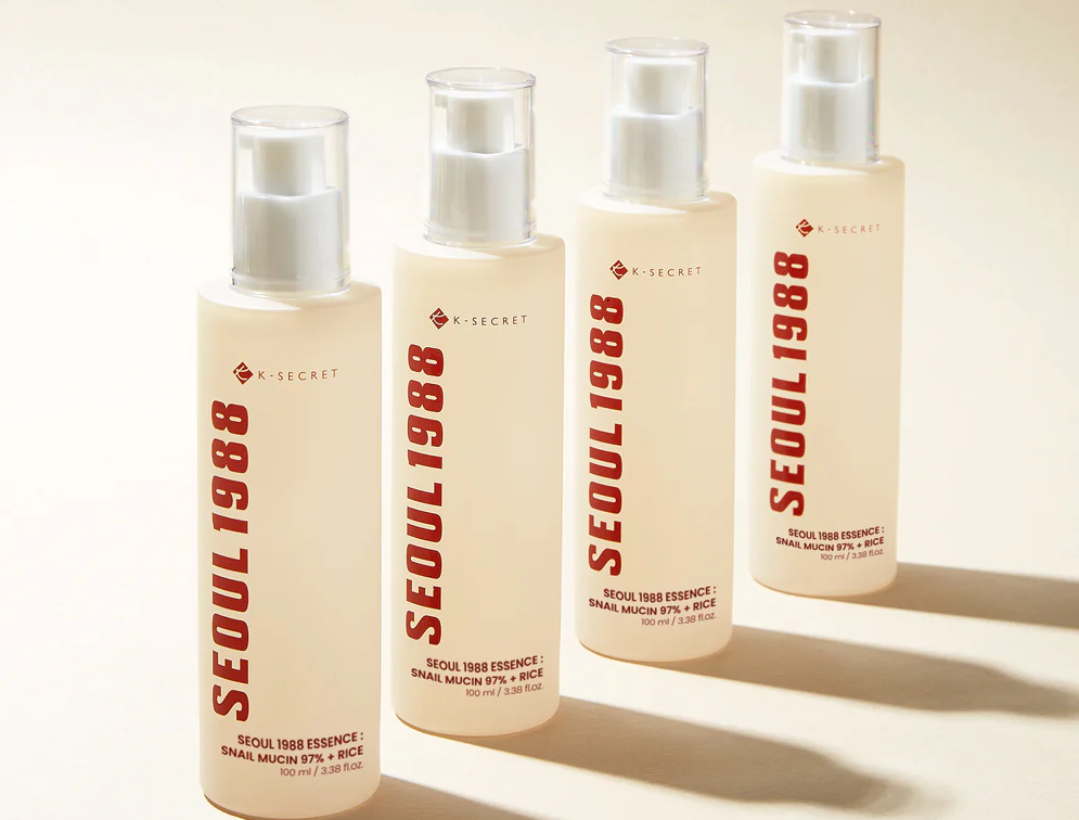 Esență regeneratoare K-SECRET Seoul 1988 cu 97% mucină de melc și extract de orez, concepută pentru repararea celulară, îmbunătățirea texturii pielii și hidratare profundă.
